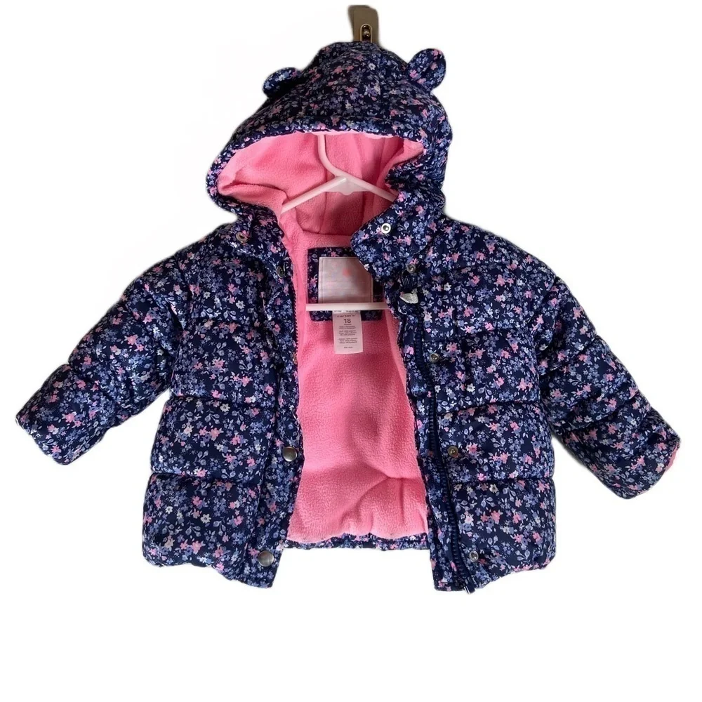 Carters Child’s Puffer Coat with Blue Floral Print. Size 18 months.